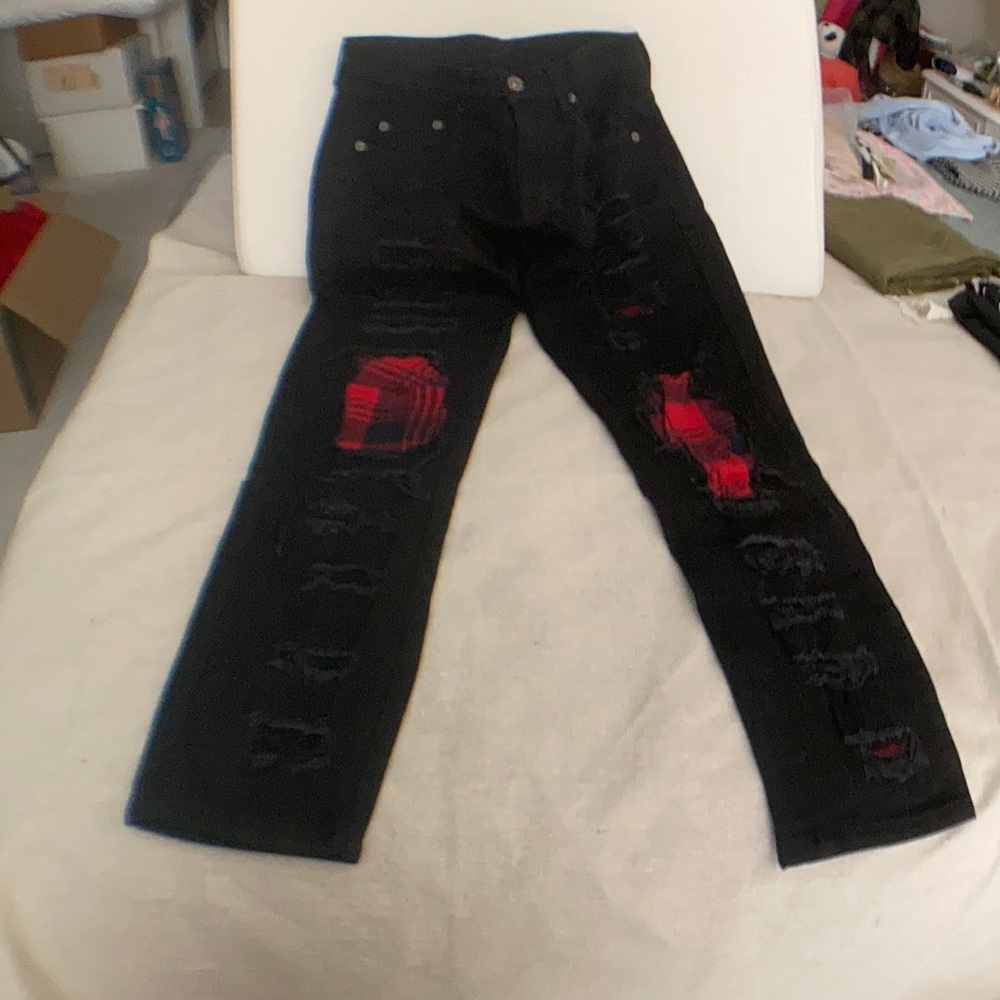 Carmar distressed jeans with red plaid patches